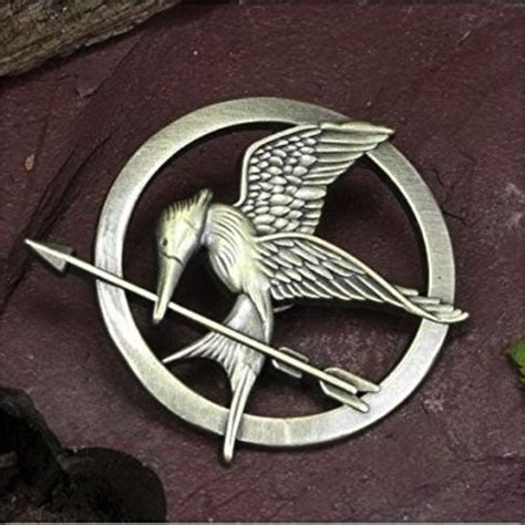 hunger games mockingjay pin|More.